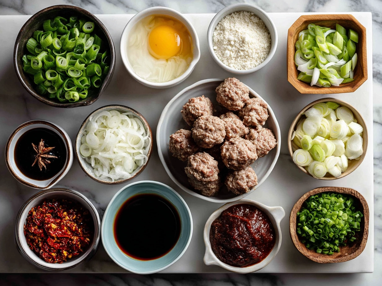 Top down view of raw ingredients for Mongolian Meatballs on marble surface